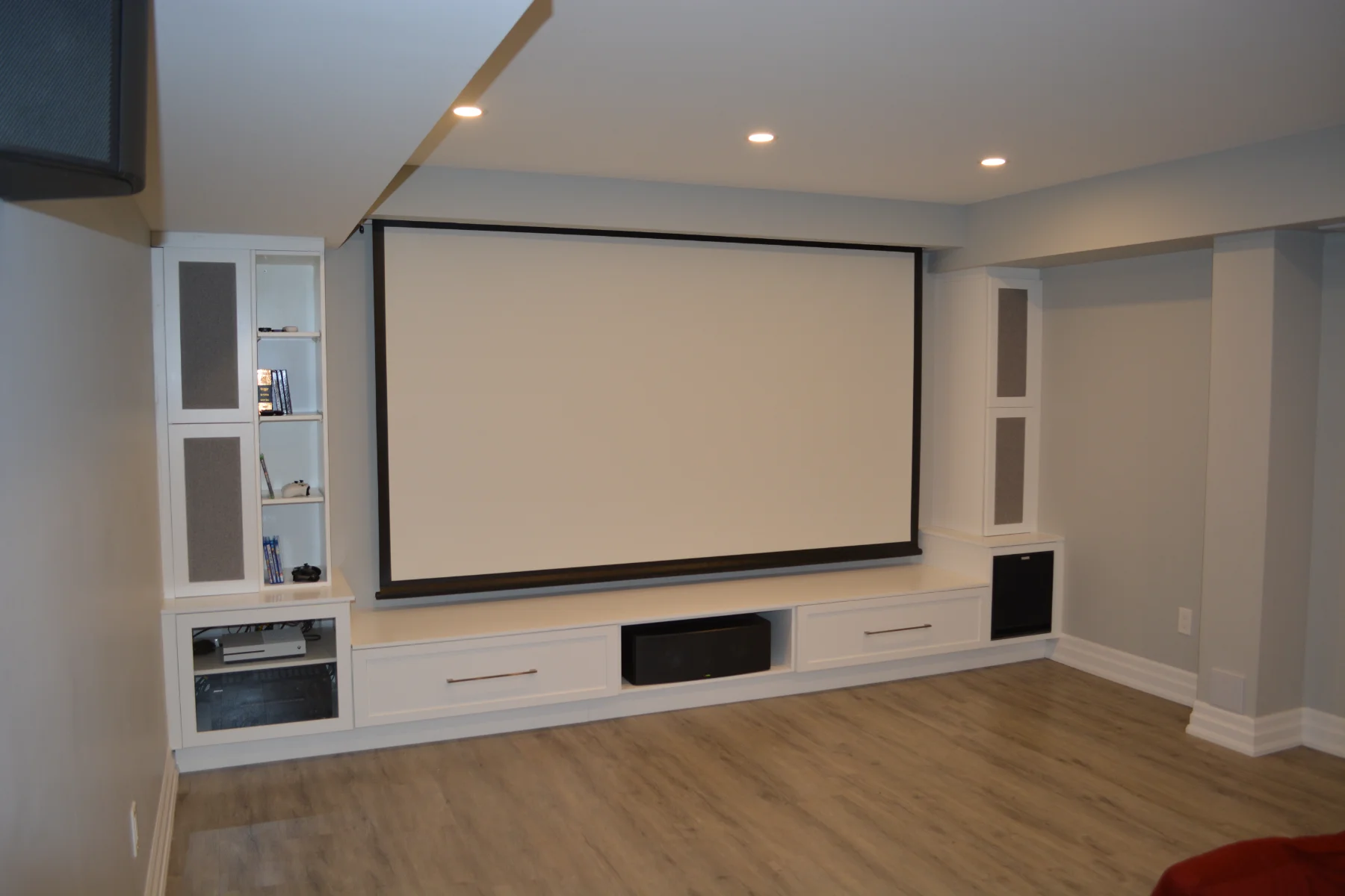 Completed Raven Cross in Markham basement home theatre with two-row seating and integrated lighting